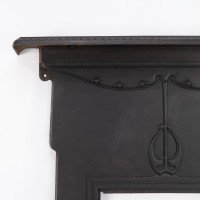 An Arts & Crafts/Art Nouveau Cast Iron Fireplace with Stylized Floral Details - Thumbnail 8