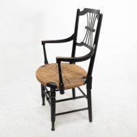 Liberty & Co., An English Aesthetic Movement Ebonized Armchair with Seagrass Seat - Thumbnail 4