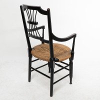 Liberty & Co., An English Aesthetic Movement Ebonized Armchair with Seagrass Seat - Thumbnail 16