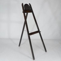An Arts & Crafts folding oak easel with a carved butterfly flying from a flower  - Thumbnail 1
