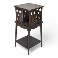 Liberty & Co., Arts & Crafts Oak Revolving Bookcase with Stylised Floral Cut-out Decoration