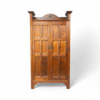 Shapland & Petter. Arts & Crafts Oak Hall Cupboard with a Ruskin Circular Jewel