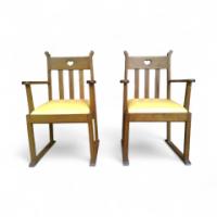 Pair of Oak Armchairs In the style of Liberty & Co. with heart cut-outs backs