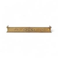 Arts & Crafts brass fender adorned with embossed floral decorations