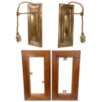 Birmingham Guild of Handicraft. A rare pair of Arts & Crafts patinated bronze wall lights with subtle raised decoration to the back plates and extending arms with oak wall frames - Thumbnail 2