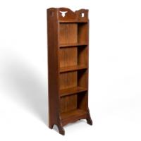 Liberty & Co., a Slim Arts & Crafts Oak Bookcase with Stylised Floral Cut-outs