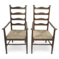 Liberty & Co., Style of. C. F. A. Voysey. A Pair of Oak Rush Seat Ladderback Armchairs