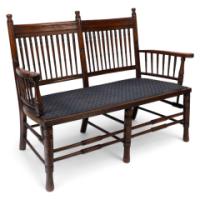 Bruce Talbert Attributed, an Aesthetic Movement Upholstered Love or Twin Window Seat