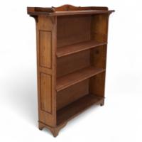 Wylie & Lochhead Attributed, an Arts & Crafts Oak Bookcase with Ying-Yang Detail to the Top & Adjustable Shelves