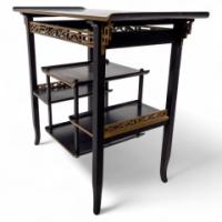 Heal's. An Anglo-Japanese Ebonised Side Table with Gilt Fretwork & Flaring Ends