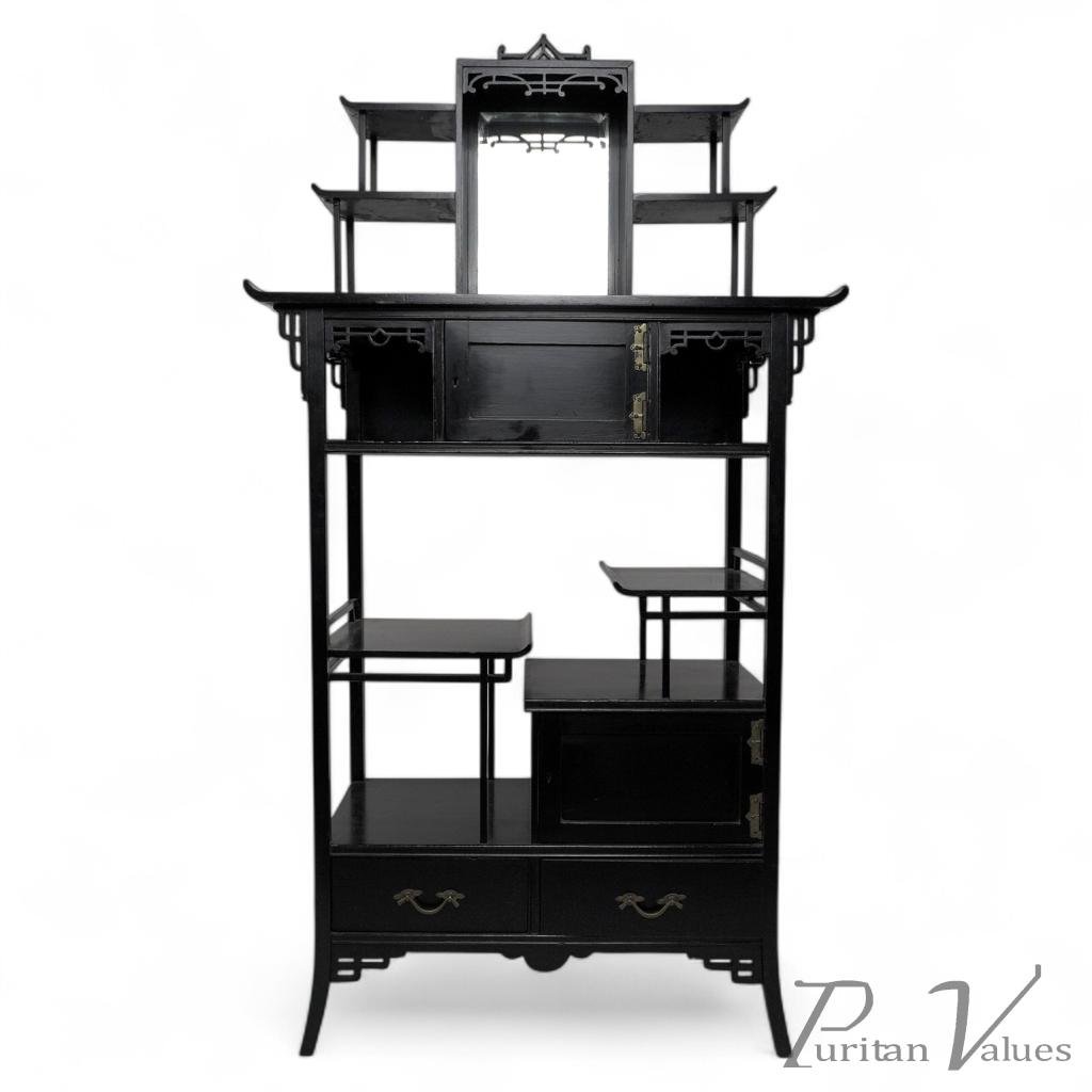 Heals, attributed. An Anglo-Japanese Ebonized Side Cabinet with Japanese Fretwork - Image 1