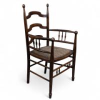 Liberty & Co. Attributed, an English Walnut Arts & Crafts Ladder Back Armchair