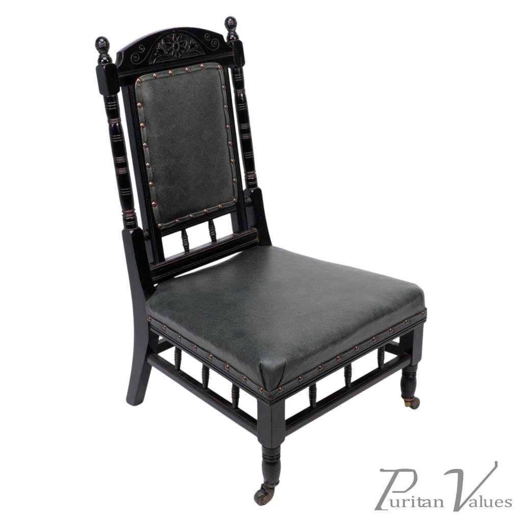 Gregory & Co., An Aesthetic Movement Nursing Chair with Stylized Carved Sunflower - Image 1