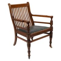 James Peddle Attributed, an Aesthetic Movement Oak Armchair with Serpentine Shaped Back
