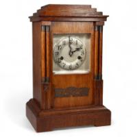 1161_a-continental-arts-crafts-oak-mantle-clock-with-carved-stylised-glasgow-roses