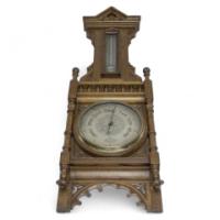 A Large Gothic Revival Carved Oak Barometer with Rare Snail Tail Thermometer