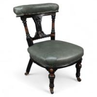 Ogdens of Manchester. An Aesthetic Movement Ebonised & Parcel Gilt Nursing Chair