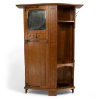 Shapland & Petter Attributed, an Arts & Crafts Oak Hall Cupboard with Flaring Cornice