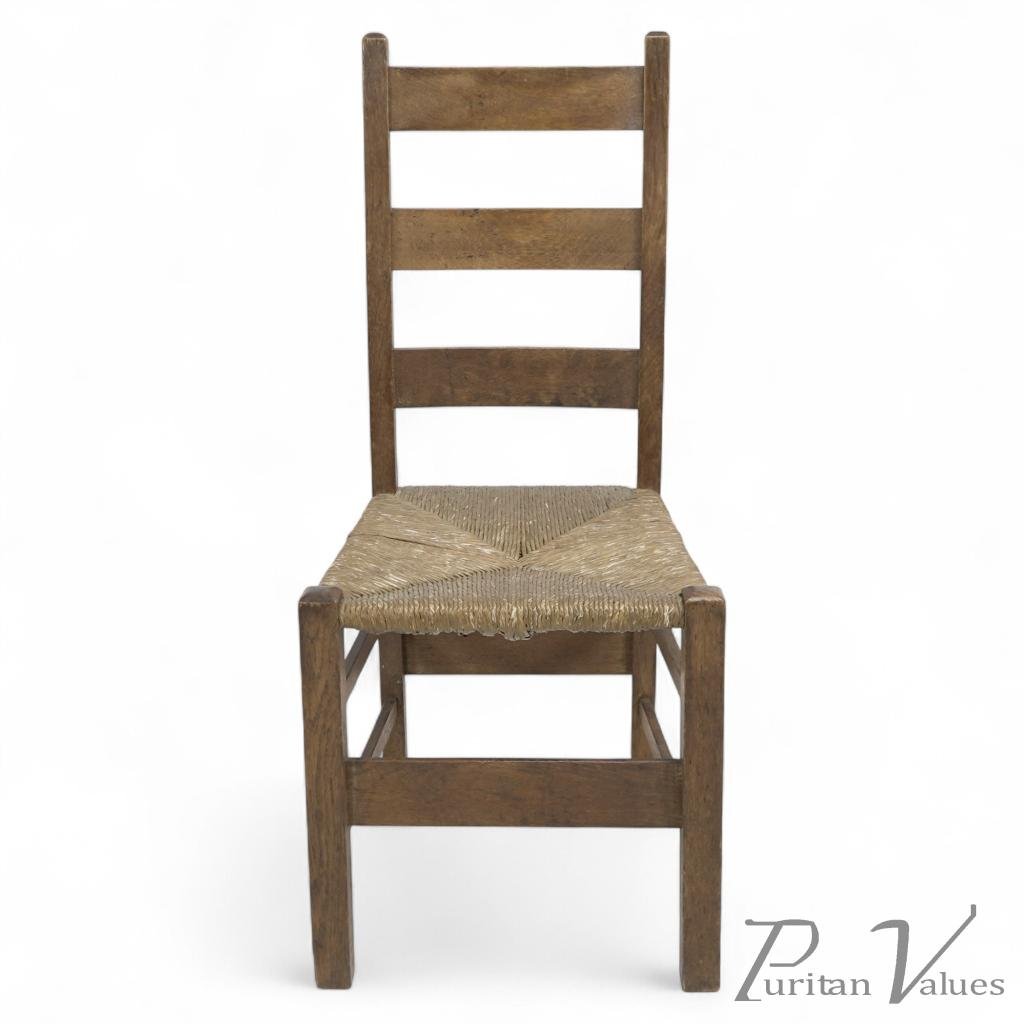Heals. London. An Arts & Crafts Ladderback with Original Rush Seat - Image 1