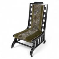 Liberty & Co. Attributed, a Moorish Ebonised Parlour Chair with Moucharabieh Turnings