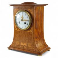 Liberty & Co., an Arts & Crafts Oak Mantle Clock with Floral Inlay