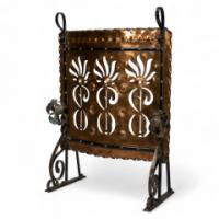 Liberty & Co., an Arts & Crafts Wrought Iron & Copper Pierced Floral Firescreen