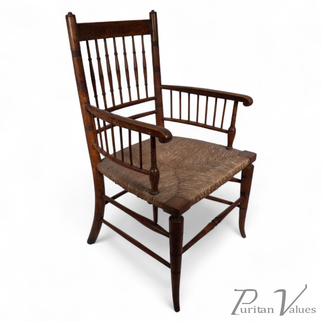 Liberty & Co., attributed. In the Style of a Morris & Co., Sussex Armchair. An Aesthetic Movement Rush Seat Armchair - Image 1