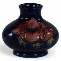 5186_william-moorcroft-a-small-anemone-blue-vase-signed-h-m-made-in-england