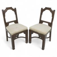 R. Boyd. In the style of Dr. C Dresser. A Pair of Aesthetic Movement Oak Side Chairs