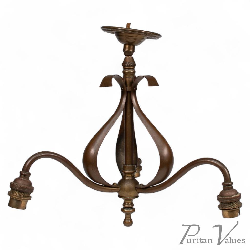 An Arts & Crafts Three Branch Brass Ceiling Light with Stylized Leaf Detail - Image 1
