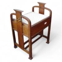 Liberty and Co (attributed). An Arts and Crafts walnut piano stool - Thumbnail 1
