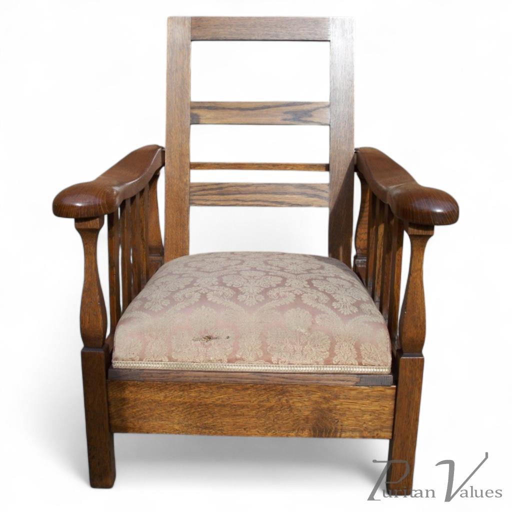 A Sculptural Arts & Crafts Reclining Oak Armchair - Image 1