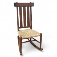An Arts & Crafts Oak rocking chair - Thumbnail 1