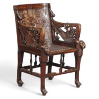 An early Egyptian Revival King Tut carved walnut elbow chair - Thumbnail 1