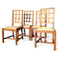 Heal's of London. A set of four Arts & Crafts Oak lattice back dining chairs - Thumbnail 1
