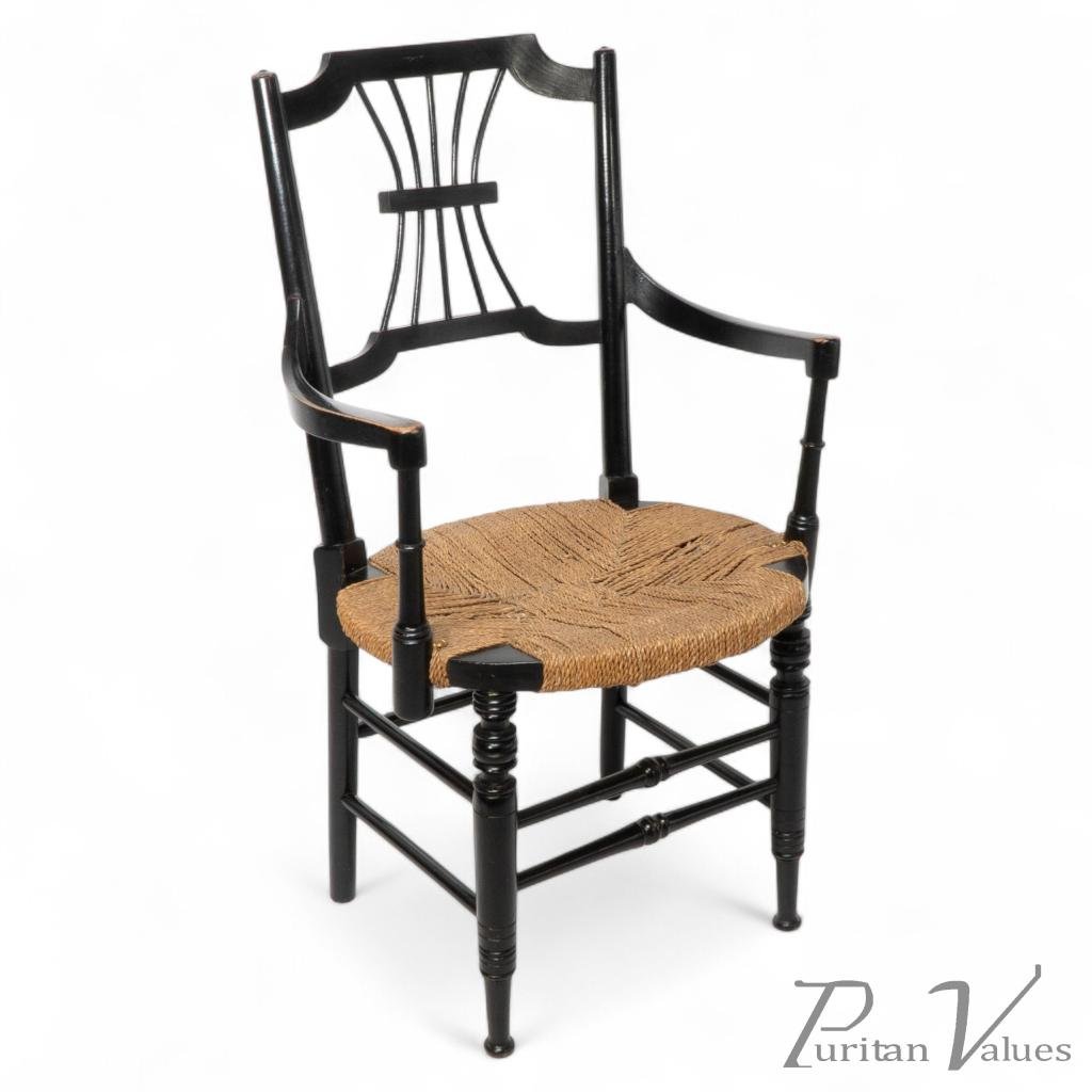 Liberty & Co., An English Aesthetic Movement Ebonized Armchair with Seagrass Seat - Image 1