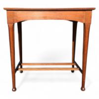 Arthur Simpson. An Arts Crafts Oak Side Table with Shaped Apron