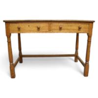 Heal's of London. An Oak Arts & Crafts Cotswold style two drawer desk - Thumbnail 1