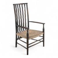 Liberty & Co., an Arts & Crafts Rush Seat Armchair with Wavy Shaped Back Slats