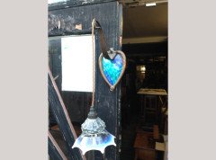 A pair of Arts & Crafts copper wall lights with peacock blue enamel heart shaped back plates. - Thumbnail 1