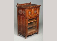 Bruce Talbert for Gillows. A carved Oak and glazed sheet music cabinet - Thumbnail 1