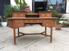 G. M. Ellwood for J. S. Henry. An Arts Crafts Oak desk inlaid with stylised floral panels - Thumbnail 1