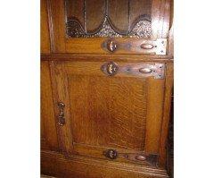 A pair of Arts & Crafts Oak glazed bookcases over a lower cupboard - Thumbnail 5