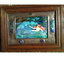 A well executed Arts & Crafts enamelled wall plaque with a Mermaid beckoning a ship - Thumbnail 1