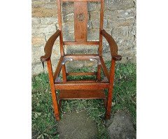 An Arts & Crafts Cotswold School Armchair with lower shelf and pierced floral detail - Thumbnail 2