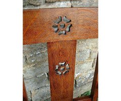 An Arts & Crafts Cotswold School Armchair with lower shelf and pierced floral detail - Thumbnail 3