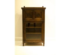 Bruce Talbert for Gillows. A Gothic revival Oak cabinet with carved florets to the front and the sides - Thumbnail 1