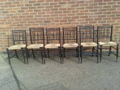 Liberty & Co. A set of Aesthetic Movement ebonised chairs after designs by Ford Maddox Brown with a Moresque style. - Thumbnail 3