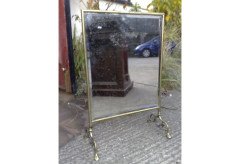 An Arts & Crafts brass fire screen - Thumbnail 1